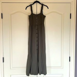 Olive green dress w ruched elastic top and straps. Faux button detail and slit.